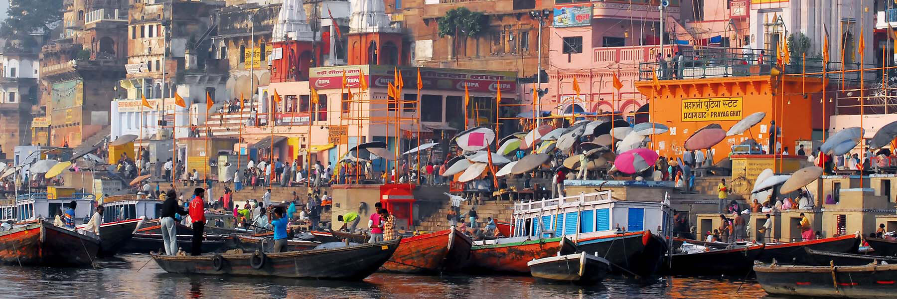 People on boats and docks in Varanasi, India